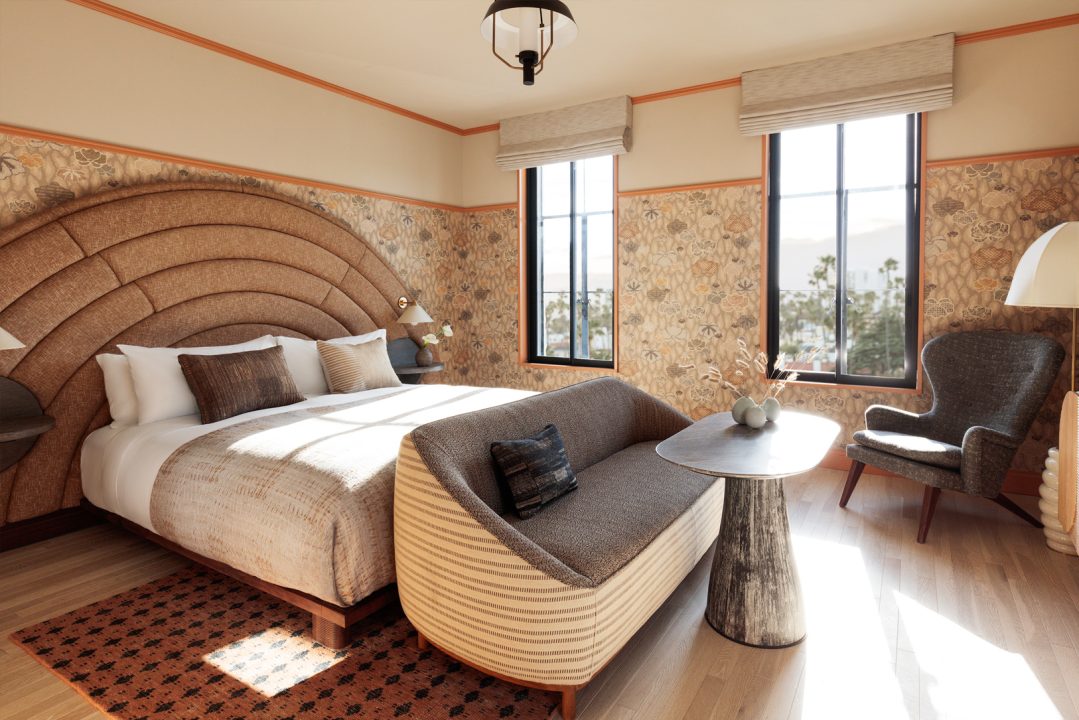 Guest room at Santa Monica Proper with an arched headboard, king bed and coastal light